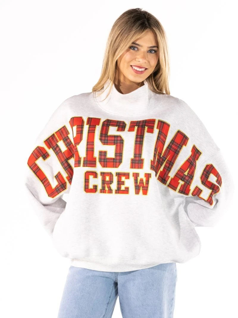Christmas Crew mock neck sweatshirt worn, showing the red plaid lettering