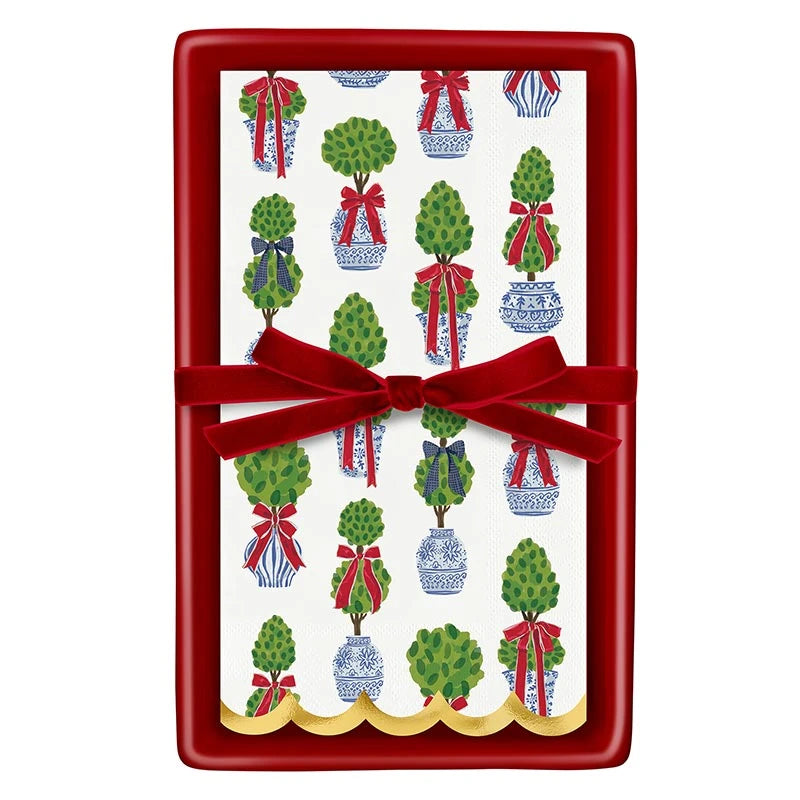 Red ceramic guest napkin tray with Holiday Topiaries napkins and velvet bow
